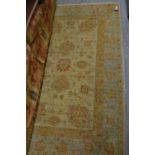 Small Afghan Ziegler rug with an all-over floral design on an ivory ground, 60ins x 40ins