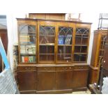 Large reproduction mahogany breakfront four door bookcase, the moulded top above four bar glazed