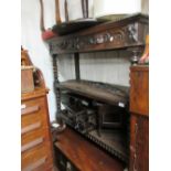 19th Century oak three tier buffet having two mask head carved drawers with barley twist supports