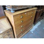 19th Century stripped pine chest of two short and four long graduated drawers with brass cup handles