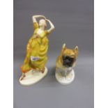 Czechoslovakian pottery figure of a girl dancer together with a Russian figure of a seated dog