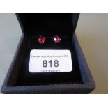 Pair of silver and treated ruby ear studs