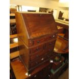 Edwardian mahogany bureau having fall front with fitted interior above five drawers with knob