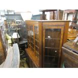 20th Century burr walnut three door bookcase, the top with glazed doors enclosing glass shelves