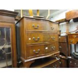 Reproduction mahogany three drawer serpentine fronted chest with bracket feet
