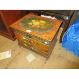 Small reproduction painted table cabinet with a hinged lid above three drawers