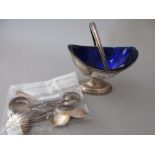 Chester silver oval pedestal bonbon basket with swing handle and blue glass liner, together with a