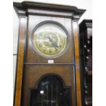 Early 20th Century Continental oak figured walnut and ebonised longcase clock, the brass dial with