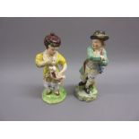 Early 19th Century Staffordshire figure of a boy and another similar of a girl holding a dog