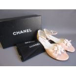 Pair of ladies Chanel pale pink low heeled sandals with four leaf clover to front, complete with
