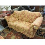 Pair of good quality floral brocade on terracotta two seater sofas