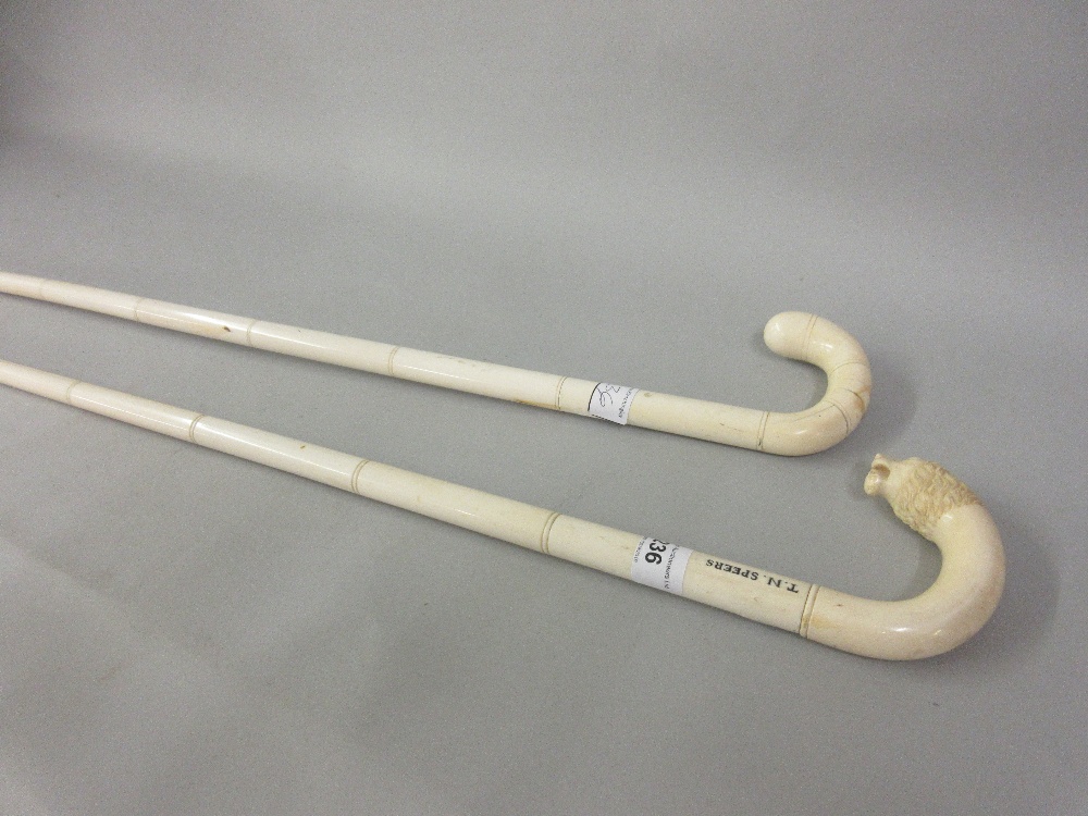 19th Century Indian carved ivory walking cane with lions head handle, together with another similar