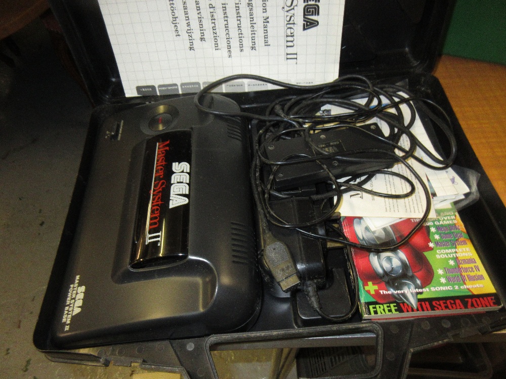 Sega Master System II power base (control pad at fault), with original carry case and various