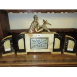 Art Deco marble and alabaster three piece clock garniture with figure surmount