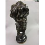 Jules Herbays patinated bronze bust of a young woman, signed in the bronze and mounted on a circular