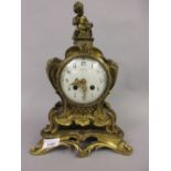 19th Century French ormolu mantel clock with cherub surmount, the enamel dial with Arabic numerals