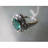 18ct White gold oval emerald and diamond cluster ring