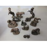 Thirteen various small bronzed composition figures of donkeys and ponies