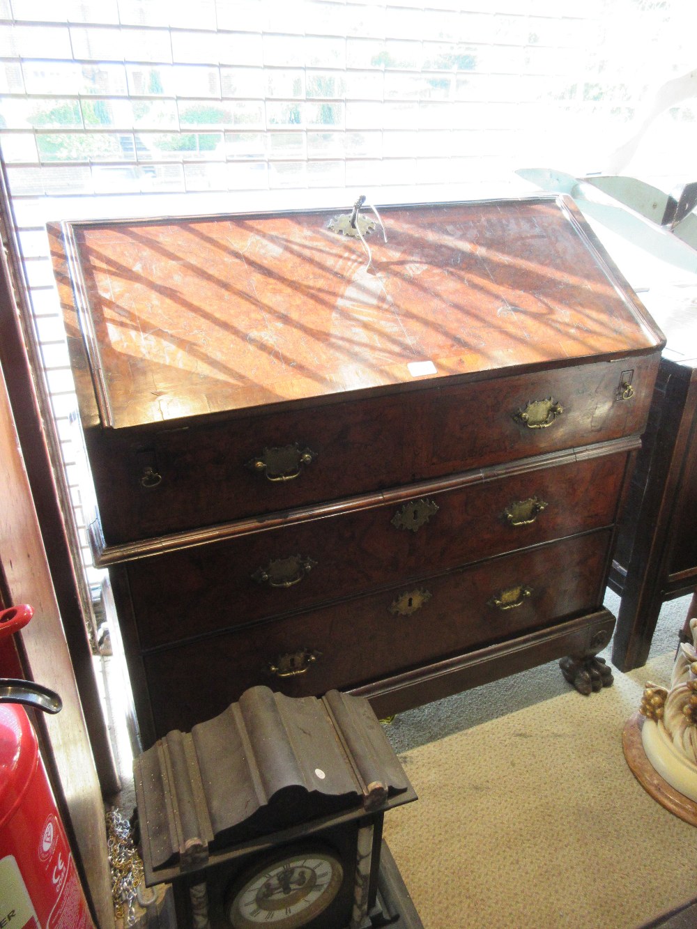 Early 18th Century walnut and herringbone crossbanded bureau, the fall front enclosing a fitted