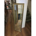 Rectangular gilt framed hall mirror with bevelled plate, 15ins x 49ins