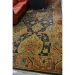 Agra carpet of all-over floral design on burgundy ground with multiple borders, 119ins x 167ins