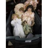 Small 1920's dressed doll together with three elaborately dressed closed mouth dolls, all with fixed