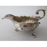 Small George II silver cream jug with floral decoration, London, 1853