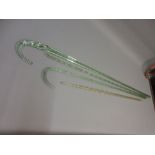 Two 19th Century glass wrythern twisted canes and two other glass canes (at fault)