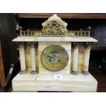 Late 19th or early 20th Century French beige onyx and gilt metal mounted mantel clock with a gallery