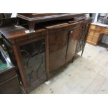 Edwardian mahogany and line inlaid semi bow fronted side cabinet with a low back above a pair of bow