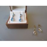 Pair of 9ct white gold drop earrings set blue topaz, together with another pair of drop earrings