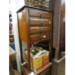 Early 20th Century mahogany four drawer music cabinet with drop handles, together with a pair of