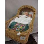 Two Armand Marseille bisque headed ' Dream Baby ' dolls with sleeping eyes in a woven basket work