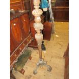 Early 20th Century carved walnut standard lamp on three C-scroll carved supports, 65ins high (for