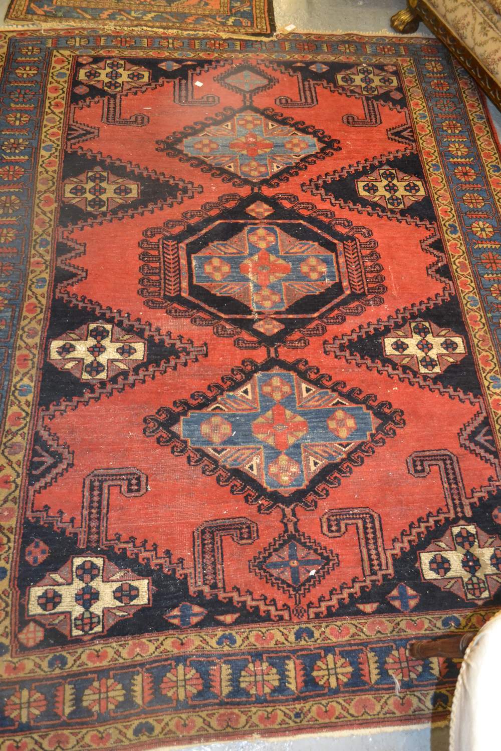 Vyse rug with repeating medallion design in shades of deep red and blue (with damages), 80ins x