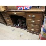 Large early 20th Century walnut twin pedestal desk with a tooled leather inset top above drawers