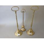 Pair of reproduction brass door stops together with another similar