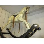 Dapple grey composition rocking horse It is made of resin / fibreglass. 34ins tall to top of head.