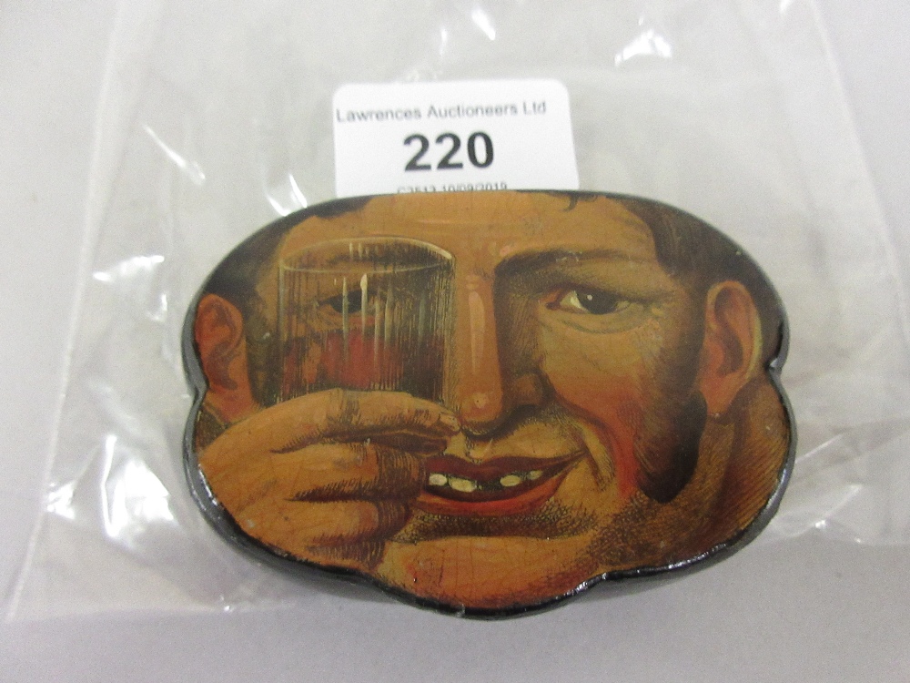 19th Century papier mache snuff box, the cover painted with a mans face