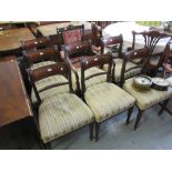 Set of seven (six plus one) Regency mahogany dining chairs, the moulded rail and rope backs above
