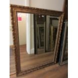 Large reproduction rectangular gilt framed wall mirror of moulded acanthus design, 56ins x 45ins