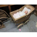 1930's Manton dolls pram with fawn and brown livery with an Armand Marseille bisque headed ' Dream