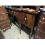 George IV mahogany and black line inlaid breakfront sideboard with a centre door flanked by a door