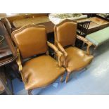 Pair of French tan leather upholstered open armchairs on cabriole front supports in Louis XV style