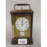 L' Epee French bronze patinated and gilded carriage clock, the enamel dial with Roman and Arabic