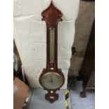 19th Century figured mahogany wheel barometer with removable thermometer having bowed glass and