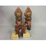 Pair of Balinese carved and painted figures of frog warriors together with a pair of owl bookends