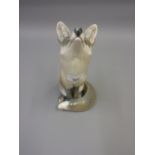 Copenhagen porcelain figure of a seated fox 10.5ins high. In good condition