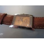 Baume Mercier gentleman's rectangular stainless steel quartz wristwatch, the gilded dial with Arabic