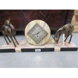 Art Deco marble mantel clock mounted with two spelter figures of deer (one missing leg)